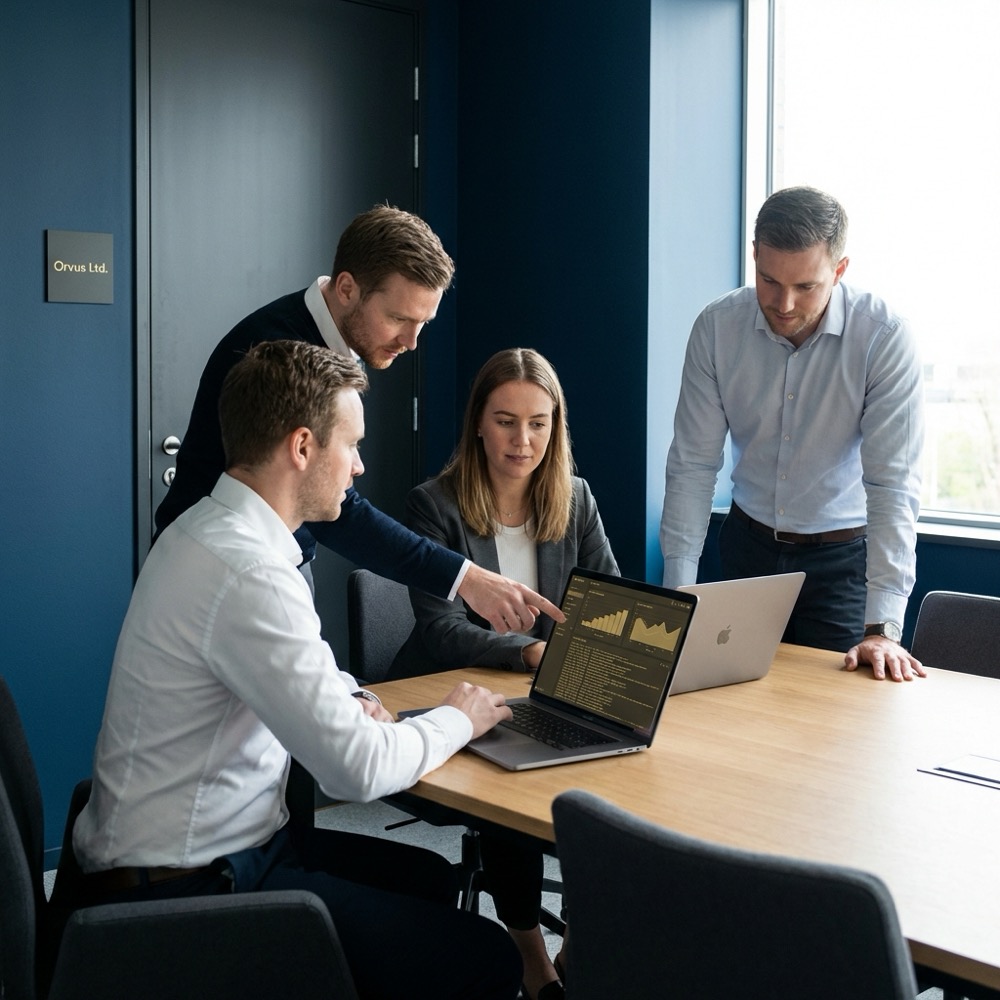 Small team reviewing analytics and server logs on a laptop in a minimalist meeting room showing magento seo performance charts and log details